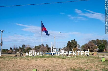 Aguas Corrientes sign and flag - Department of Canelones - URUGUAY. Photo #82005